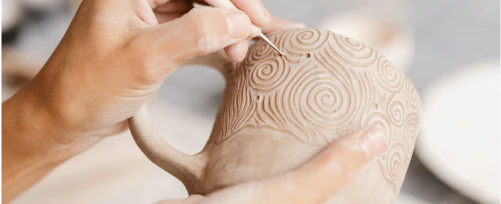 Person doing pottery