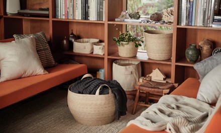 storage bins on a shelf in the living room