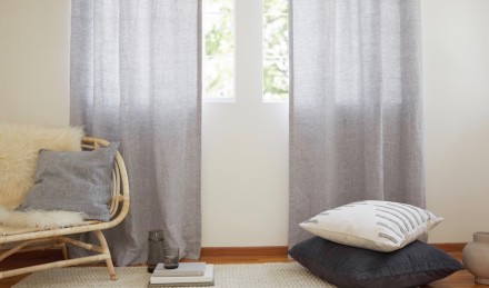 Grey Curtains in Bedroom with floor pillows