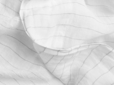 Close Up Of Grey Pinstripe Linen Top Sheet
