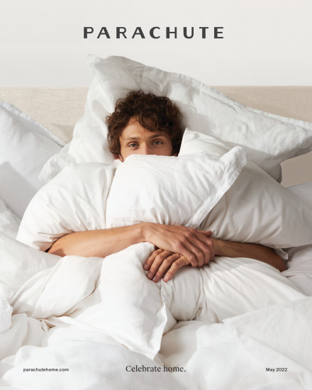 A man engulfed in white bedding