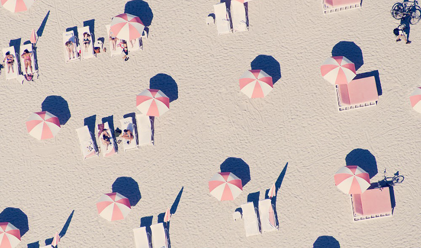 Image of umbrellas and sunbeds on the beach