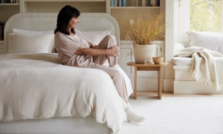 woman sitting on a bed