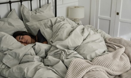 Woman sleeping on Organic Cotton Sheets in Willow
