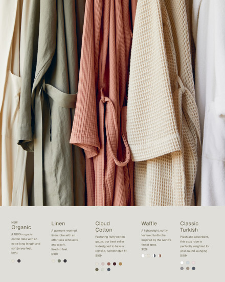 Robes of various colors and textures hanging on a hook