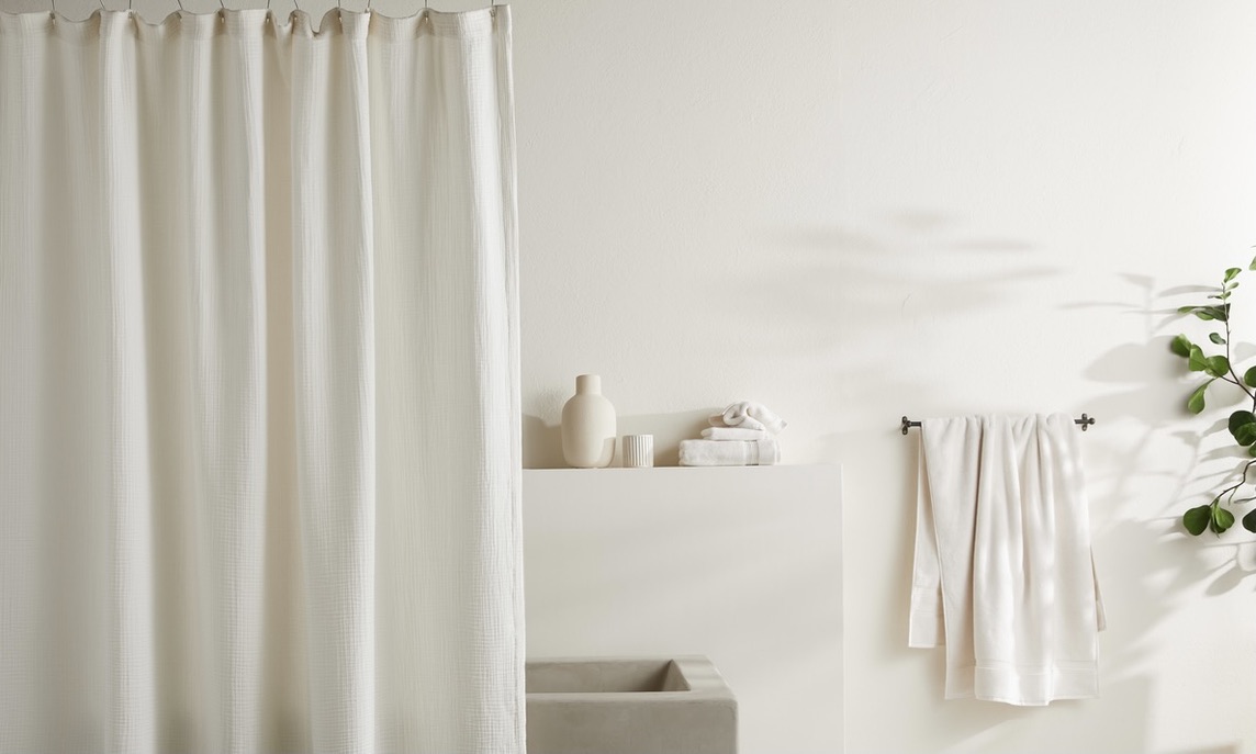 Add extra storage with an extra shower curtain rod, then all you