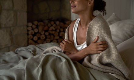 woman wrapped in a cozy blanket