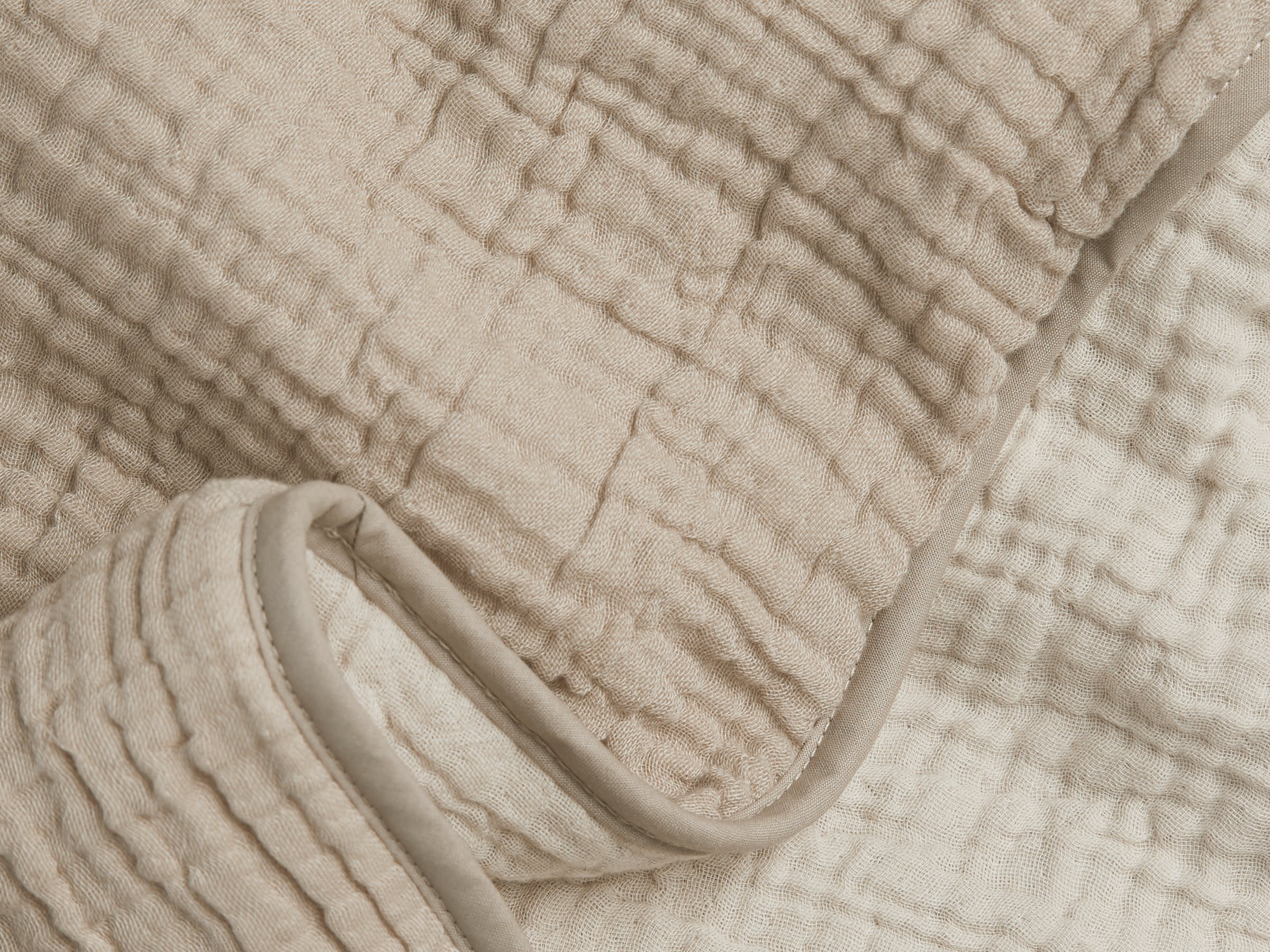 Close Up Of Natural And Ivory Cloud Cotton Toddler Quilt