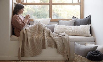 woman on a couch in a blanket 