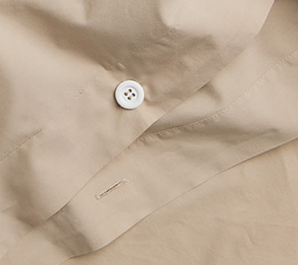 Detail photo of tan organic cotton bedding