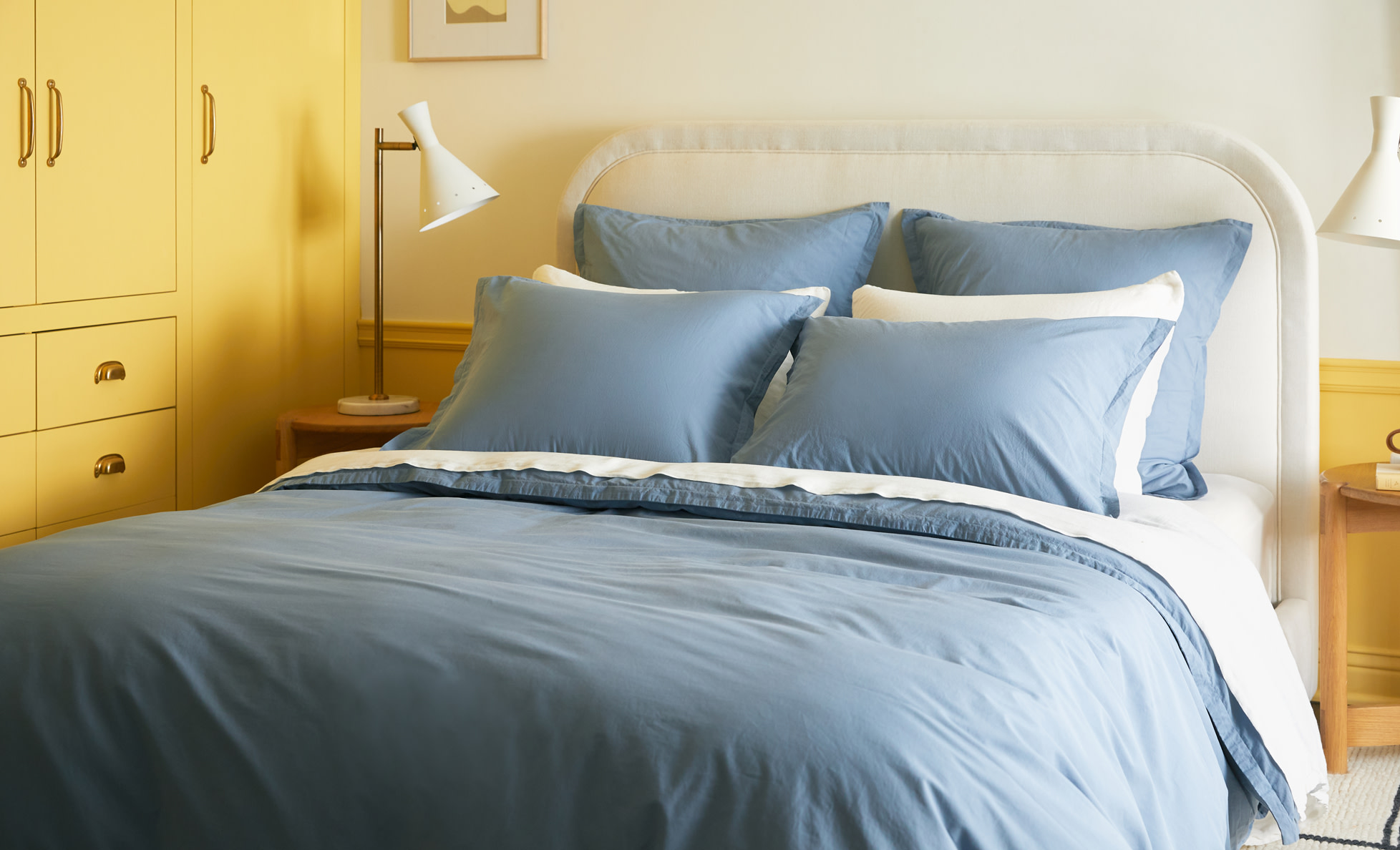 Neatly made bed with Wave colored Percale Sheeting