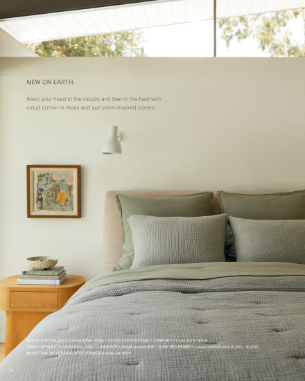 A bed displaying bedding in earth color tones.