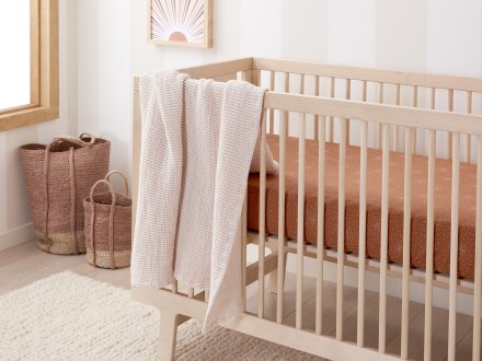 Confetti Crib Sheet Shown In A Room