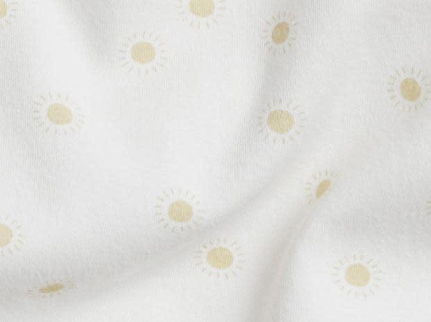 Close Up Of White Sunburst Footie Pajama