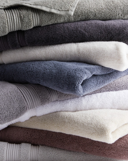 A stack of classic turkish cotton towels in different colors