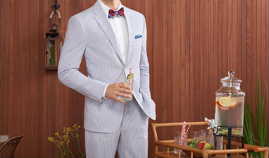 a man dressed in a summer suit 
