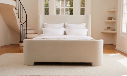 Bed frame in white bedroom. 