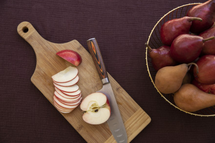 Apples being sliced. 