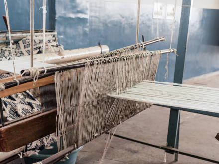 Photograph of a threads being woven together