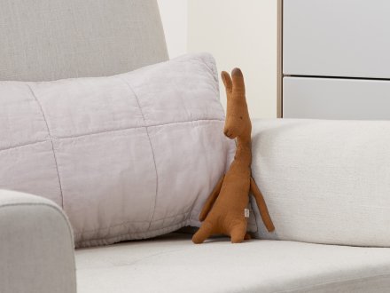 Stuffed Giraffe Shown In A Room