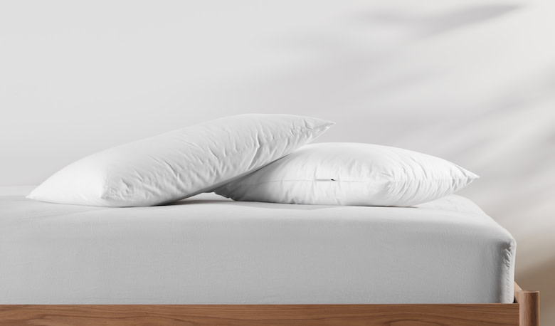 Two pillows on a mattress