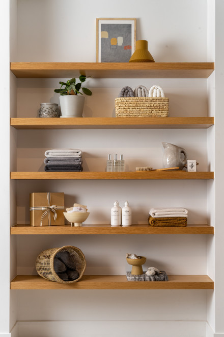 Shelves with artfully styled objects and Parachute products