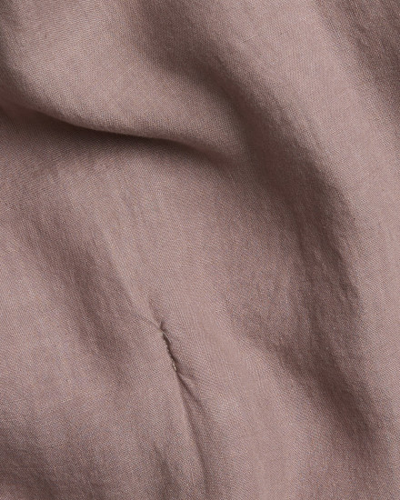 Detail photo of a clover purple linen quilt