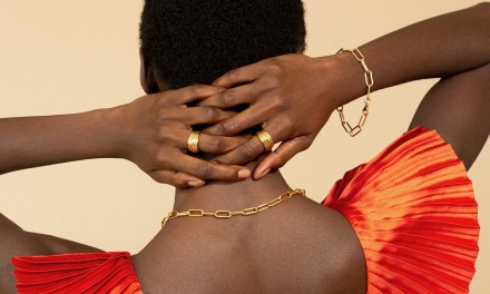 Woman modeling gold jewelry