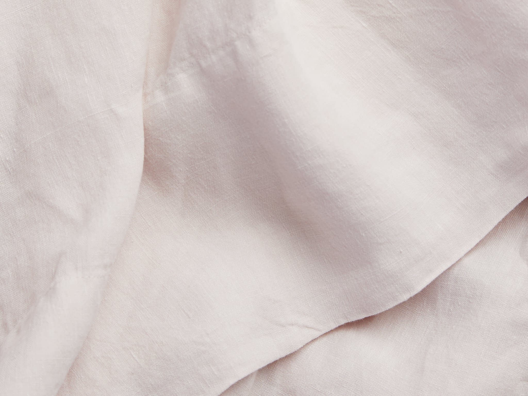 Close Up Of Blush Linen Top Sheet