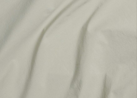 A detail photo of willow green organic cotton sheets