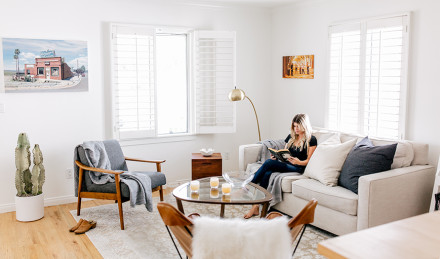 A woman sitting in a living room 