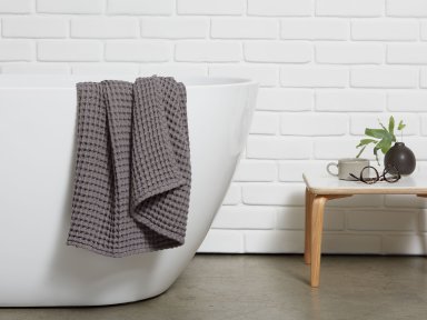Charcoal Waffle Towels Shown In A Room
