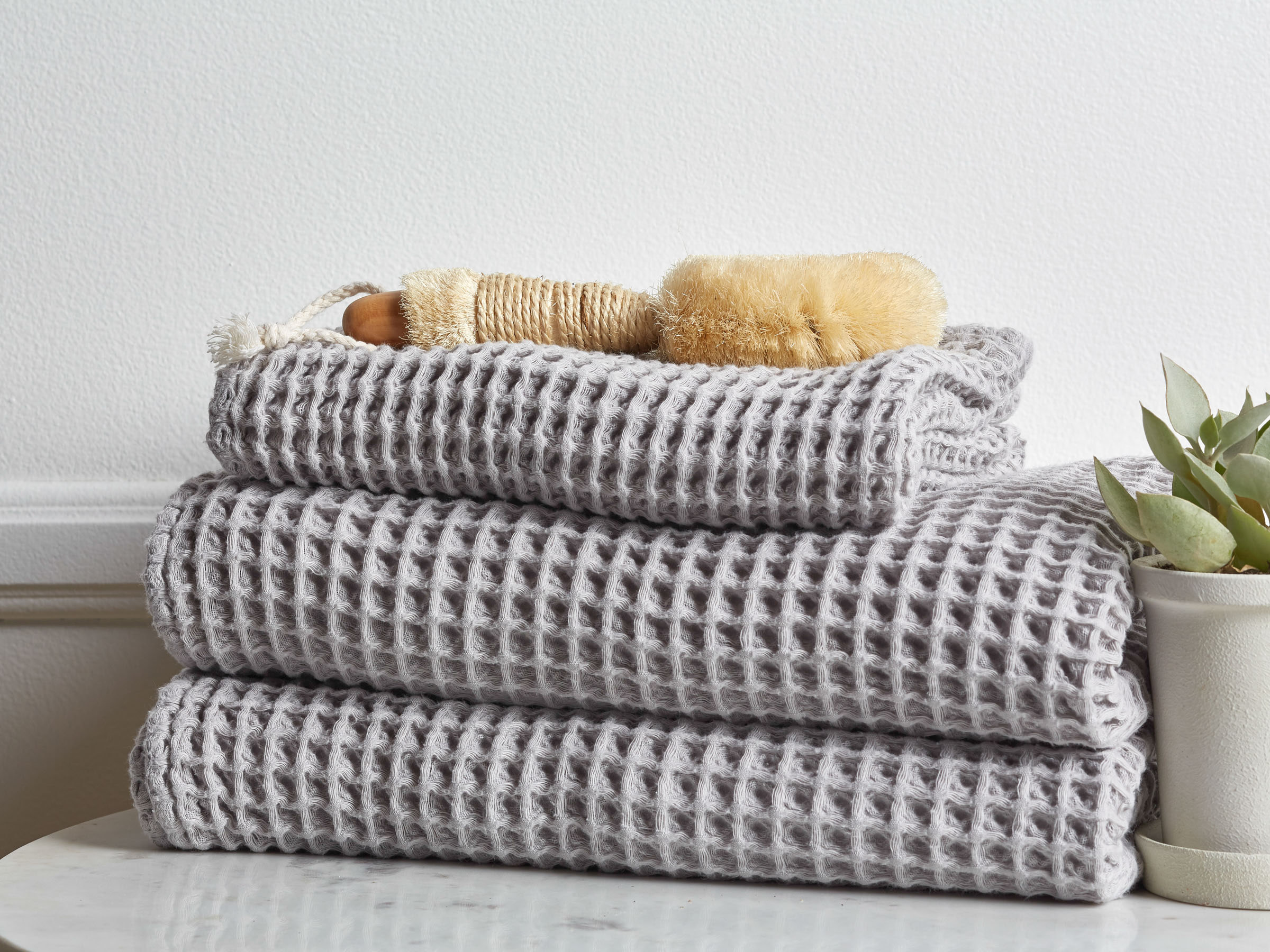 Grey Waffle Towels Shown In A Room