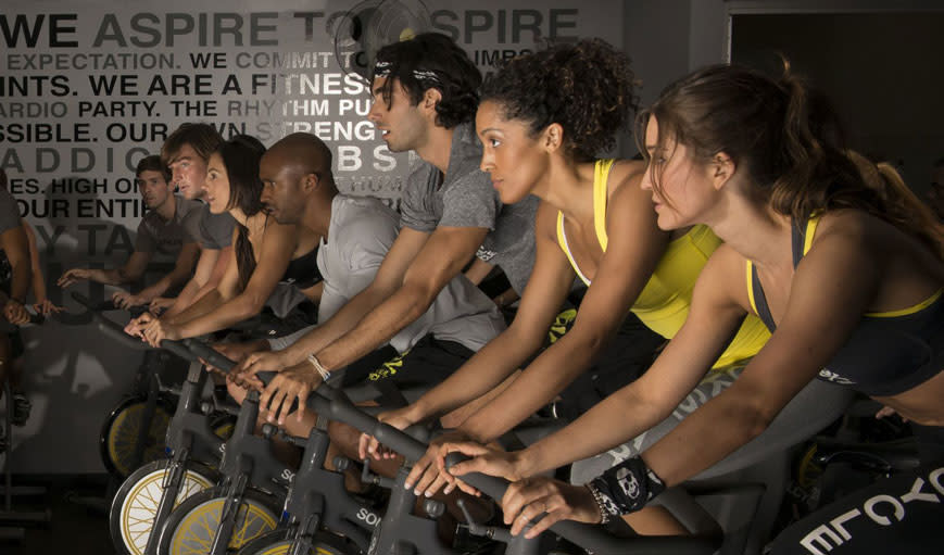 People taking a soul cycle class