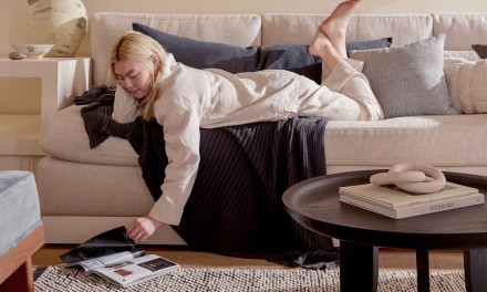 Woman reading on couch. 