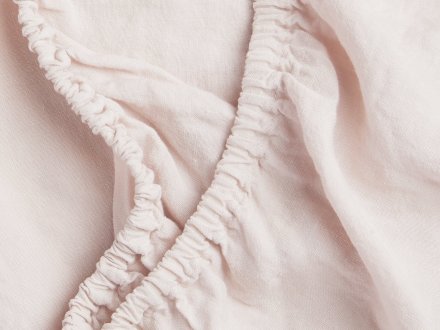 Close Up Of Linen Crib Sheet