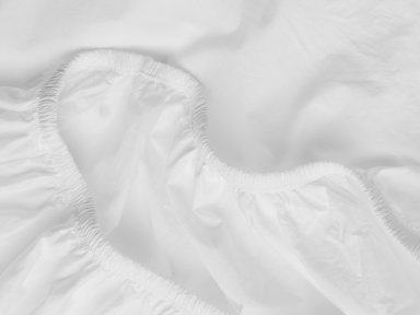 Close Up Of White Percale Crib Sheet