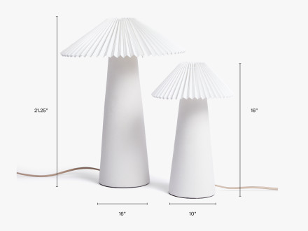 A table lamp that is 21.25" tall by 16" wide next to a table lamp that is 16" tall and 10" wide