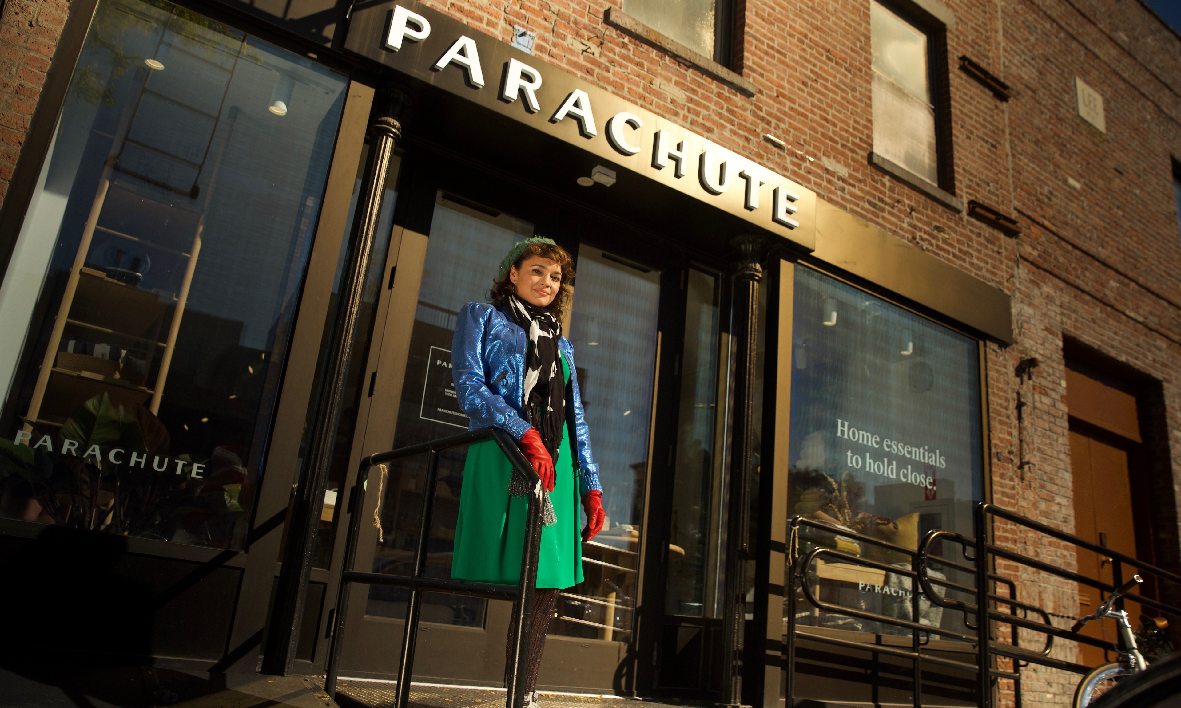 Norah Jones standing in front of the Parachute store. 