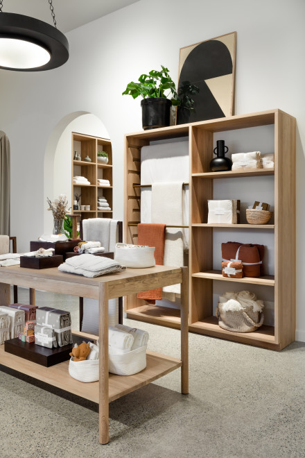 Random assortment of home items stacked on wall shelving