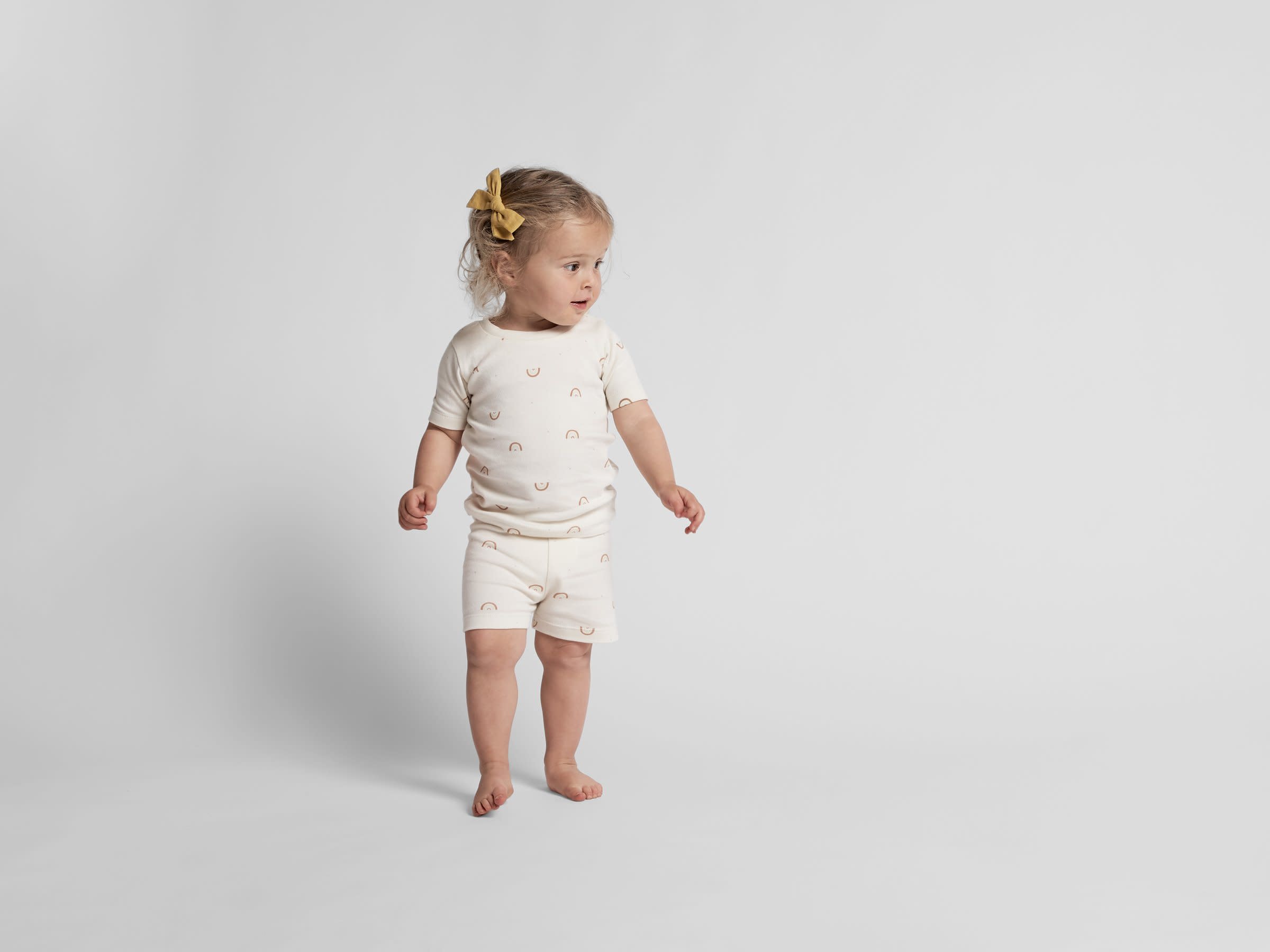 White Rainbow Pajama Set Shown In A Room