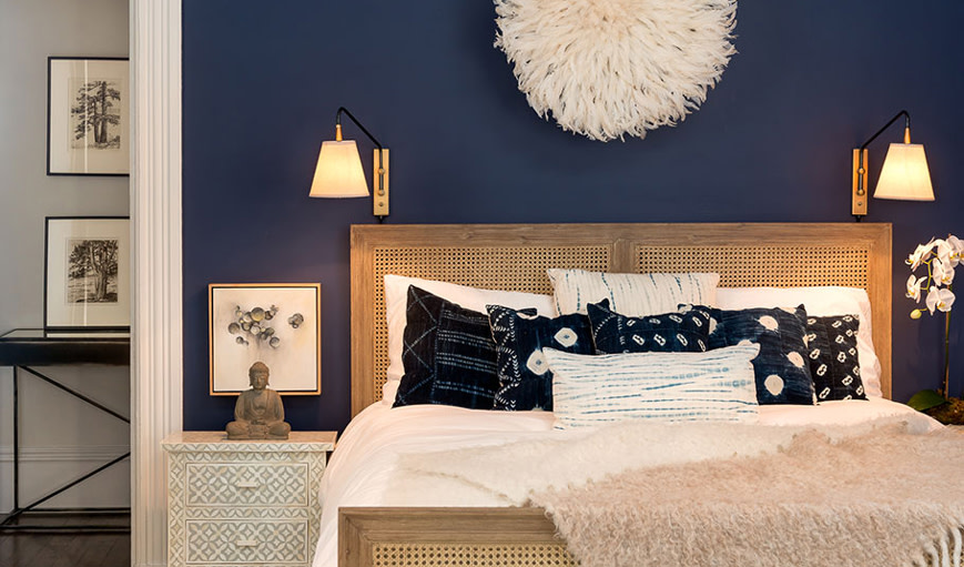 bedroom with a navy accent wall 