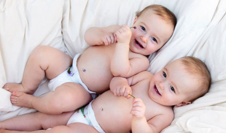 Two babies wearing eco-friendly diapers 