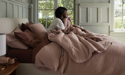 woman in bed with lots of blankets