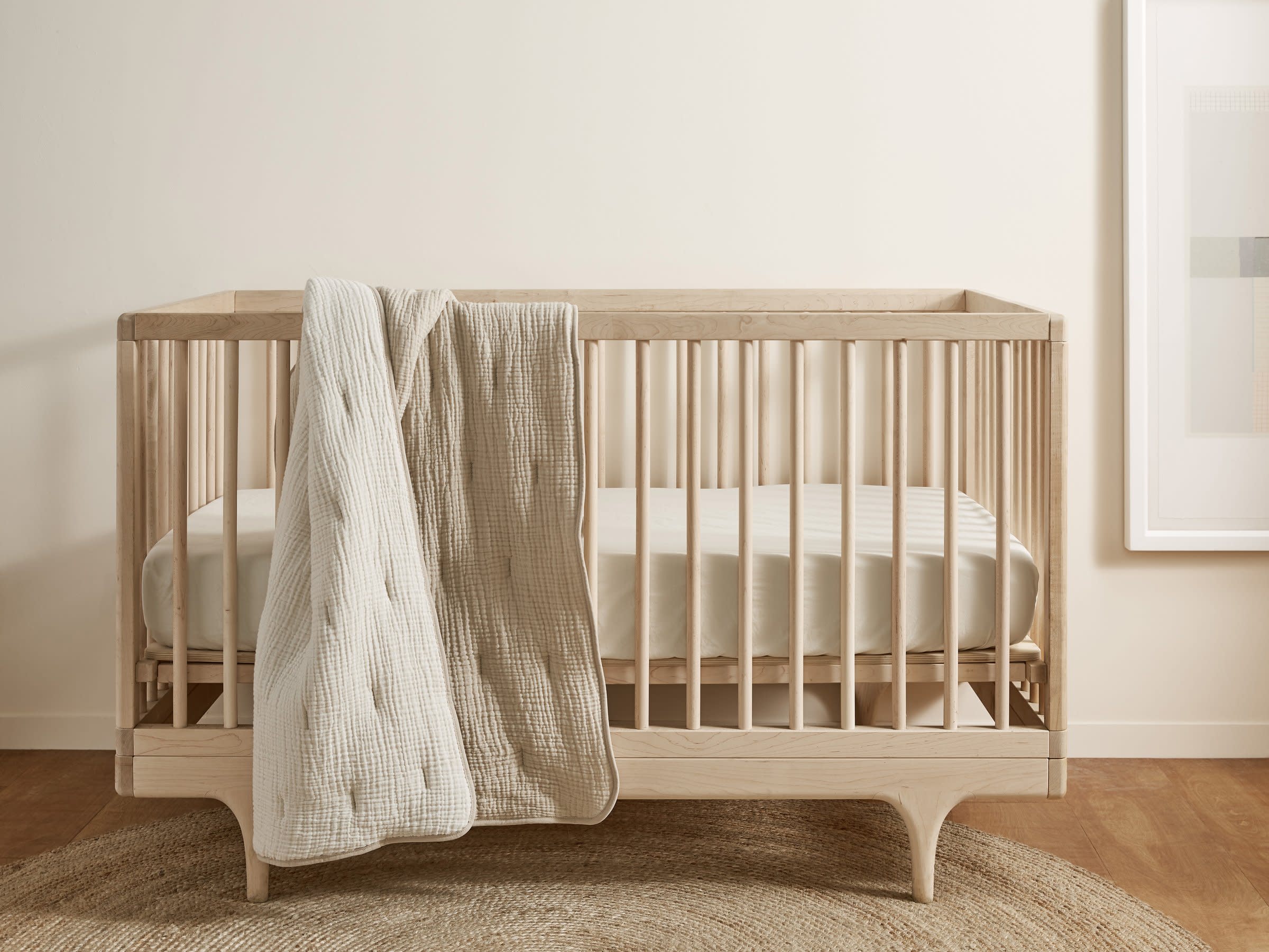 Ivory Brushed Cotton Crib Sheet Shown In A Room
