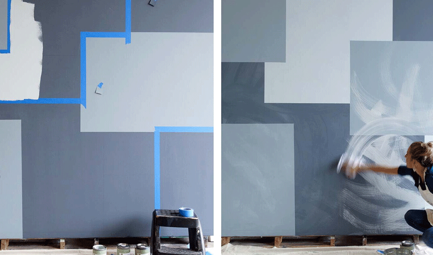 Image of a woman painting a patchwork wall.