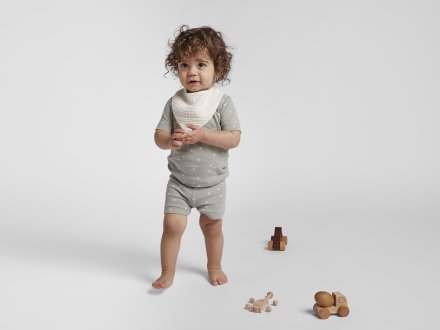 Bandana Bib Set Shown In A Room