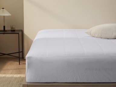 Cotton Mattress Protector Shown In A Room