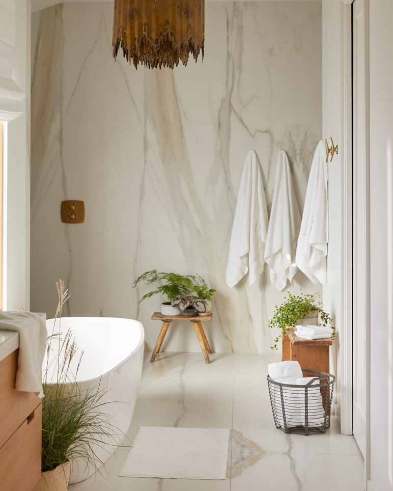 White towels hanging in a bright bathroom