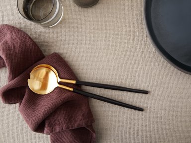 Black And Gold Serving Set Shown In A Room